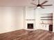 Living room with cozy fireplace, built-in bar, and wine fridge, ideal for entertaining at 7808 The Esplanade Ct, Orlando, FL 32836