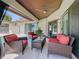 A beautiful outdoor patio with cushioned seating and a ceiling fan for enjoying the outdoors at 7808 The Esplanade Ct, Orlando, FL 32836