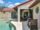 Outdoor seating area with dining table and poolside views at 7808 The Esplanade Ct, Orlando, FL 32836