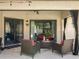 Inviting covered patio with comfortable seating, perfect for relaxing outdoors at 7808 The Esplanade Ct, Orlando, FL 32836
