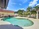 Inviting backyard featuring a private pool and lush tropical landscaping at 7808 The Esplanade Ct, Orlando, FL 32836