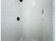 Updated shower features bright white tile and modern matte black fixtures at 7808 The Esplanade Ct, Orlando, FL 32836