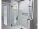 Modern glass walk in shower with a white subway tile surround at 7808 The Esplanade Ct, Orlando, FL 32836