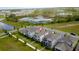 Aerial view of homes near a scenic lake, illustrating a peaceful community setting at 11015 Bostwick Aly, Winter Garden, FL 34787