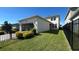 Exterior shot of the backyard featuring a well-maintained lawn and secure fence at 11015 Bostwick Aly, Winter Garden, FL 34787