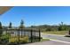 Scenic backyard view featuring a black metal fence and glimpses of a tranquil landscape at 11015 Bostwick Aly, Winter Garden, FL 34787