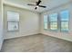Bright bedroom with large windows offering ample natural light and tile floors at 11015 Bostwick Aly, Winter Garden, FL 34787