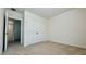 Spacious bedroom featuring neutral carpet and a closet with double doors at 11015 Bostwick Aly, Winter Garden, FL 34787