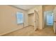 Bright bedroom featuring neutral carpet, a window with blinds, and a closet at 11015 Bostwick Aly, Winter Garden, FL 34787