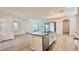 Open kitchen design with central island, granite countertops, and stainless steel appliances at 11015 Bostwick Aly, Winter Garden, FL 34787