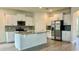 Well-equipped kitchen featuring white cabinetry, granite counters, and stainless appliances at 11015 Bostwick Aly, Winter Garden, FL 34787