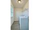 Bright laundry room featuring a washer, dryer, shelving, and a window for natural light at 11015 Bostwick Aly, Winter Garden, FL 34787