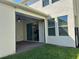 Covered patio leading to a manicured lawn and featuring outdoor ceiling fan and sliding glass doors at 11015 Bostwick Aly, Winter Garden, FL 34787