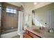 Bathroom featuring a bathtub, shower, and a light wood vanity at 11041 Se 169Th Pl, Summerfield, FL 34491