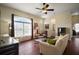 Bright living room with tile flooring, lots of natural light, and comfortable furniture at 11041 Se 169Th Pl, Summerfield, FL 34491