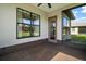 Covered patio with view of the landscaped backyard at 11041 Se 169Th Pl, Summerfield, FL 34491
