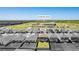 Community aerial view features modern homes with manicured lawns, plus an elementary school within walking distance at 1179 Tyler Loop, Winter Haven, FL 33884