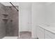 Stylish bathroom features a tiled shower, modern fixtures, and single vanity sink at 1179 Tyler Loop, Winter Haven, FL 33884