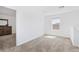 Bright bedroom features neutral carpet, natural light, and a view of the landing at 1179 Tyler Loop, Winter Haven, FL 33884