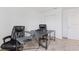 Carpeted home office space with modern desk and a comfortable executive chair at 1179 Tyler Loop, Winter Haven, FL 33884