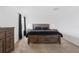 Carpeted main bedroom with dresser, nightstand, and full size bed at 1179 Tyler Loop, Winter Haven, FL 33884