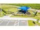 Community playground featuring modern play structures, seating, and a safety-conscious design, perfect for children at 1179 Tyler Loop, Winter Haven, FL 33884