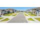 Wide street view showcases the neighborhood's well-maintained sidewalks, landscaping, and curbside parking at 1179 Tyler Loop, Winter Haven, FL 33884