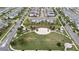 Panoramic aerial view of townhomes nestled in a well-planned community with a central park at 12180 Sonnet Ave, Orlando, FL 32832