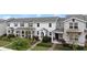 Charming two-story townhomes with landscaped front yards and inviting entrances, exuding curb appeal and community at 12180 Sonnet Ave, Orlando, FL 32832