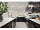 Open concept kitchen with stainless steel appliances and views into the living area at 12180 Sonnet Ave, Orlando, FL 32832