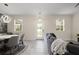 Bright living room with modern lighting, tile floors, and large windows showing the exterior at 12180 Sonnet Ave, Orlando, FL 32832
