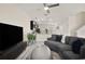 Open-concept living space with a modern kitchen flowing into a comfortable living area at 12180 Sonnet Ave, Orlando, FL 32832
