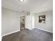 This bedroom has neutral paint and a window overlooking the yard at 1311 Bryn Mawr Ave, Lake Wales, FL 33853