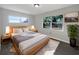Bright bedroom with a large bed, soft bedding, and dual windows overlooking the outdoors at 1311 Bryn Mawr Ave, Lake Wales, FL 33853