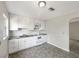 Well-lit kitchen with white cabinets and appliances, offering a clean and functional space at 1311 Bryn Mawr Ave, Lake Wales, FL 33853