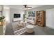 Cozy living room featuring a plush sofa, modern decor, and ample natural light at 1311 Bryn Mawr Ave, Lake Wales, FL 33853