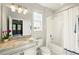 Bright bathroom with granite countertop, tub and shower combo, and natural light at 13202 Spring Grove Way, Winter Garden, FL 34787