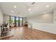 Bright bonus room featuring wood floors, natural light, and ceiling fans at 13202 Spring Grove Way, Winter Garden, FL 34787