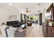 A cozy living room with access to an outdoor patio offers plenty of space for seating and entertaining guests at 13202 Spring Grove Way, Winter Garden, FL 34787