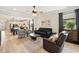 A well-lit living room provides plenty of seating and opens up to the kitchen for an open, inviting space for gatherings at 13202 Spring Grove Way, Winter Garden, FL 34787
