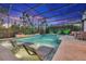 A serene screened-in pool setting features in-pool loungers for ultimate relaxation under the open sky at 13202 Spring Grove Way, Winter Garden, FL 34787