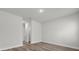 This bedroom features modern finishes, wood-look flooring, and neutral walls at 13673 Sw 43 Cir, Ocala, FL 34473