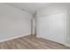 An empty bedroom with wood-look floors and a large closet, waiting for your personal touch at 13673 Sw 43 Cir, Ocala, FL 34473