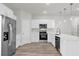 Beautiful kitchen with stainless steel appliances, white cabinets, and wood-look floors at 13673 Sw 43 Cir, Ocala, FL 34473