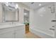 Bathroom boasts modern features, including a shower-over-tub and a bright white vanity sink at 1370 Alberta Dr, Winter Park, FL 32789