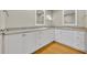 Bathroom featuring dual sinks, granite countertops, and white cabinetry at 1370 Alberta Dr, Winter Park, FL 32789