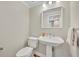 Powder room features classic fixtures and a clean, minimalist design at 1370 Alberta Dr, Winter Park, FL 32789