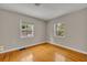 Bright bedroom with hardwood floors, neutral walls, and natural light at 1370 Alberta Dr, Winter Park, FL 32789