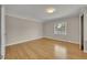 Bright bedroom featuring hardwood floors, natural light and neutral walls at 1370 Alberta Dr, Winter Park, FL 32789