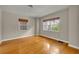 Cozy bedroom with hardwood floors, neutral walls, and natural light at 1370 Alberta Dr, Winter Park, FL 32789